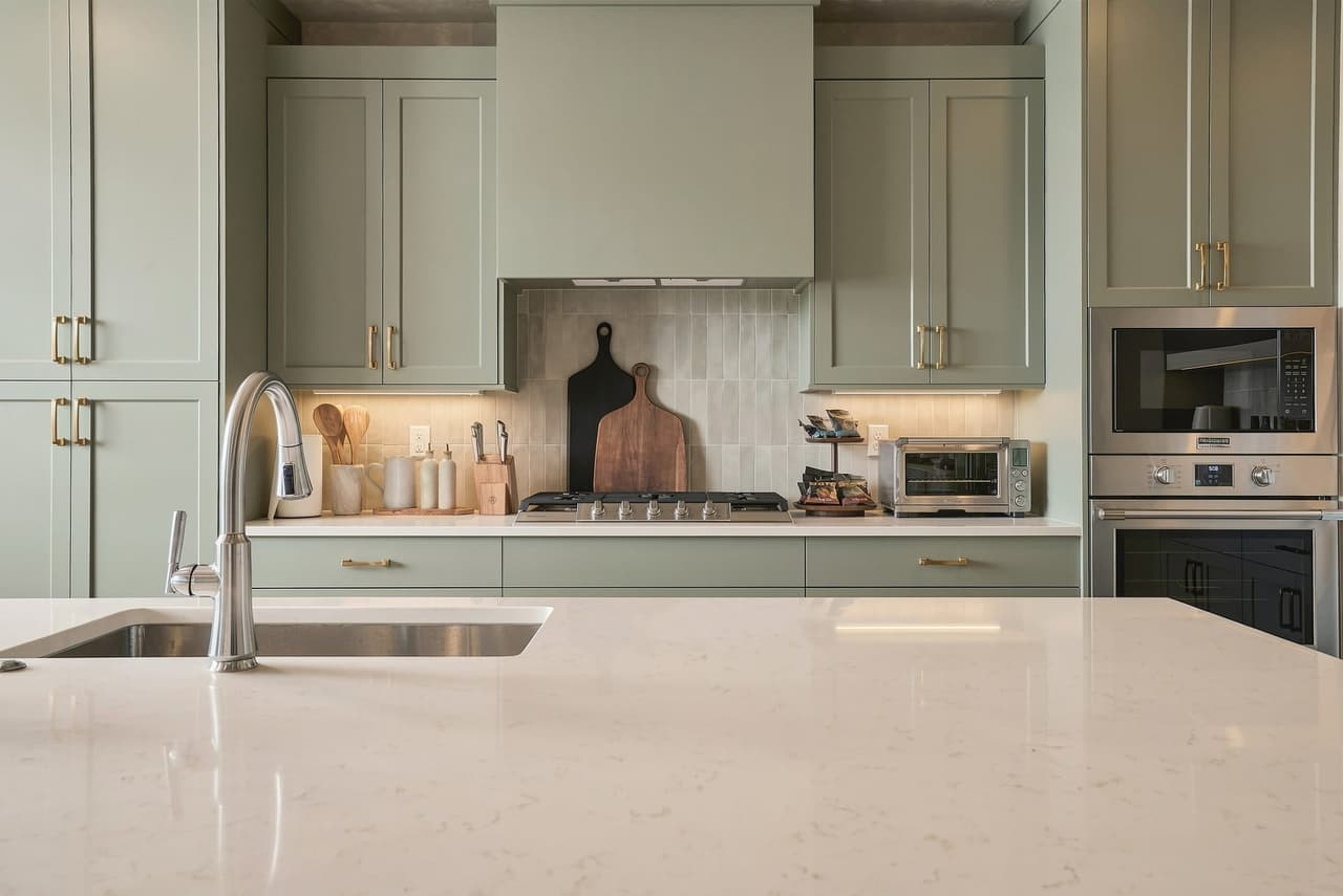 Zephyr House sage kitchen — design that turns a house into a brand