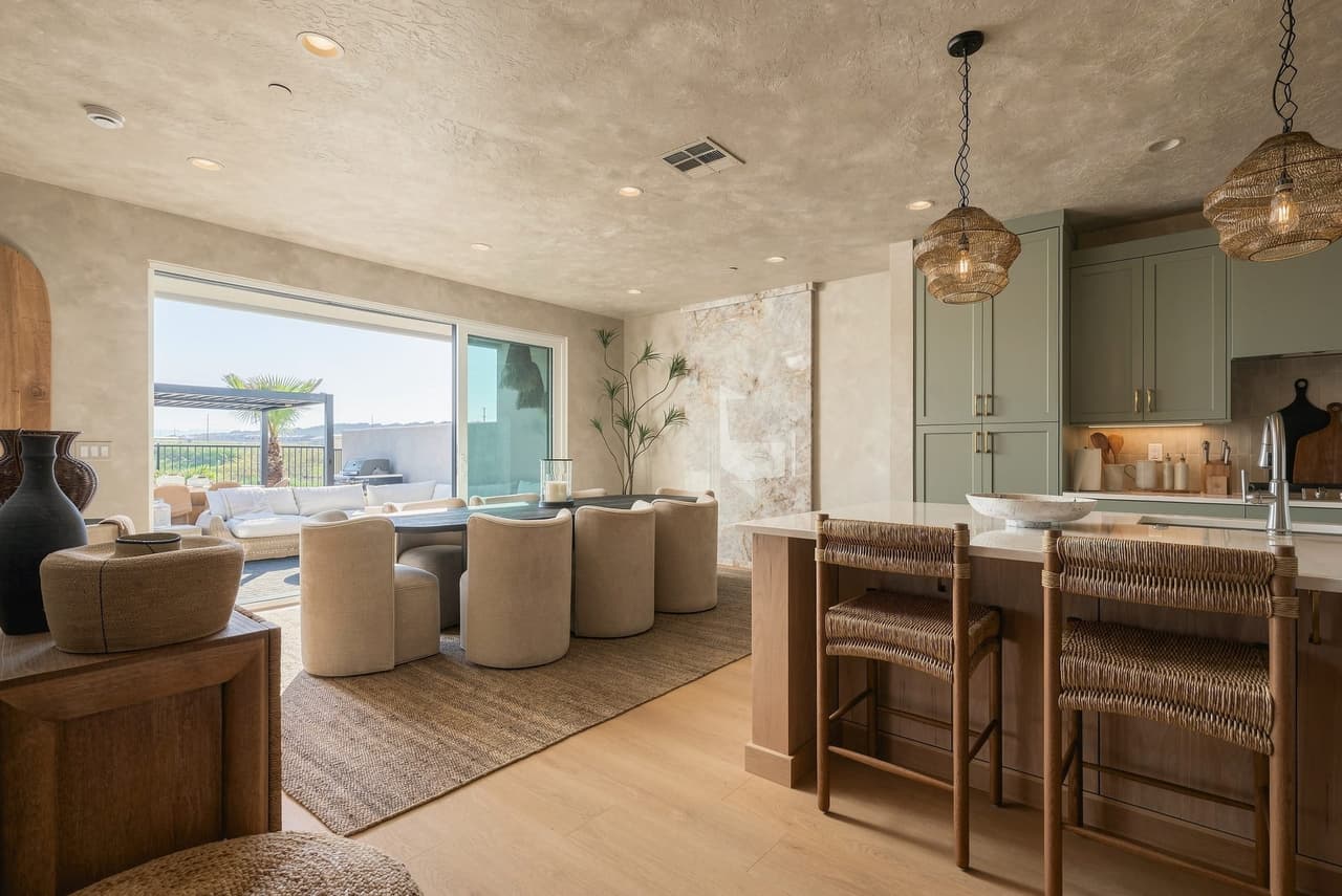 Zephyr House kitchen and dining opening to the patio