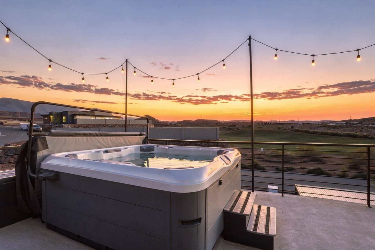 Rooftop hot tub at sunset at Zephyr House